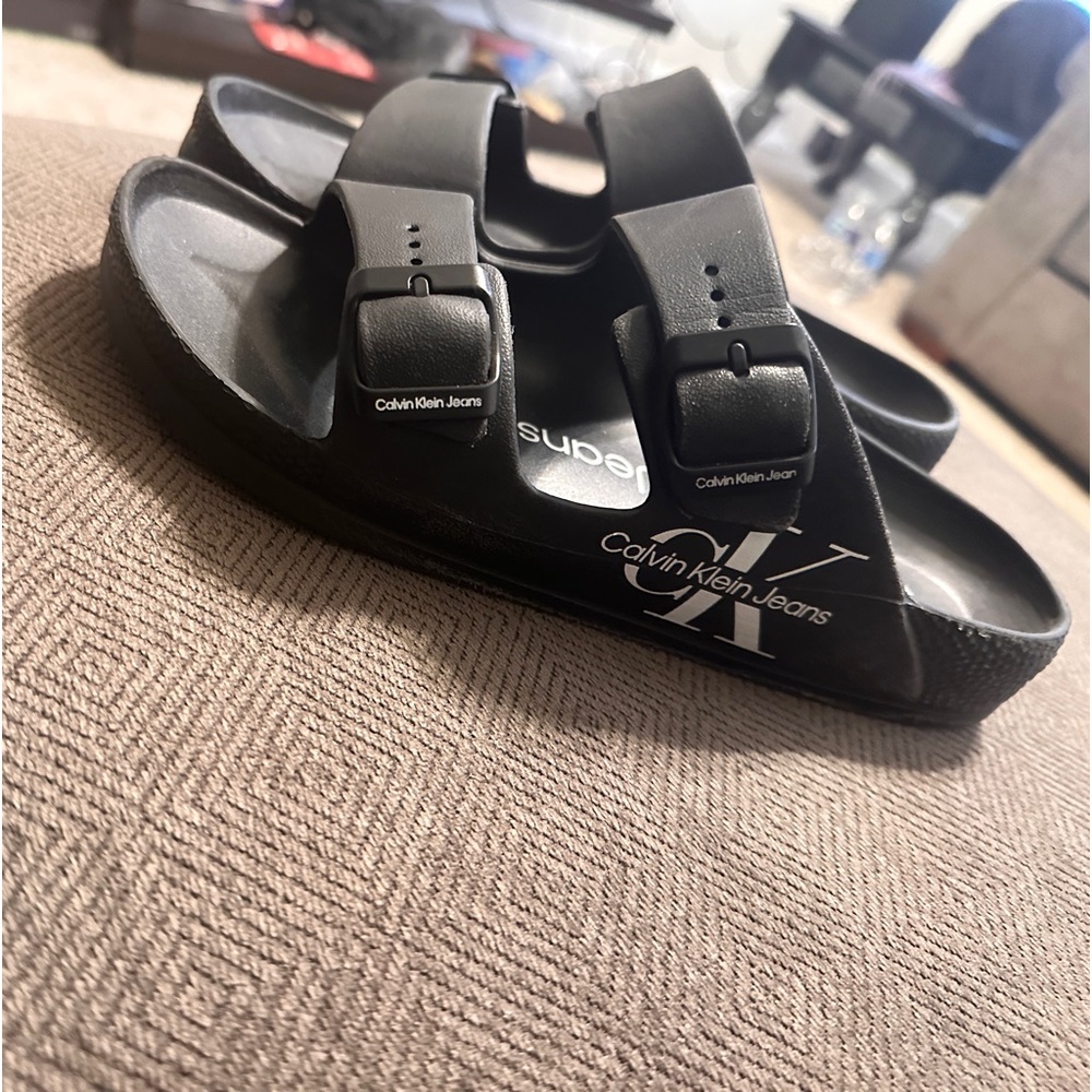 Black Calvin Klein slides